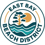 The image shows the East Bay Beach District logo: a circular emblem with a sun, tree, and waves, and teal text reading &ldquo;EAST BAY BEACH DISTRICT.&rdquo; logo on footer section. Link to external website.